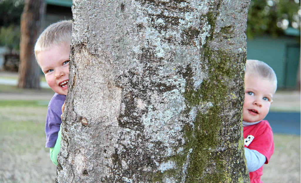 Tommy, 3, and Jarvis Miller, 1, dressed warm for an afternoon play in the park to tire them out before bedtime.